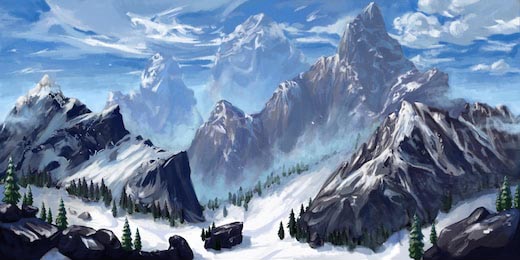 Горы покрытые снегом на фоне облачного неба