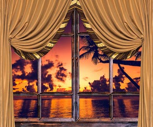 Вид из открытого окна с занавеской на закат