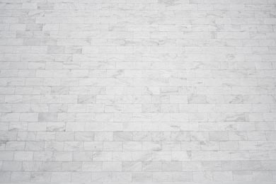 Белая мраморная кирпичная стена