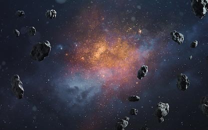 Космический фон с астероидами и светящими звездами